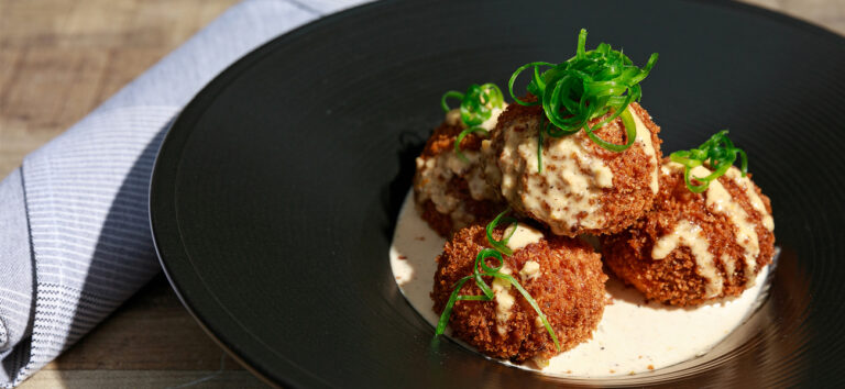 Plate of Beausoleil Coastal Cuisine’s crawfish arancini