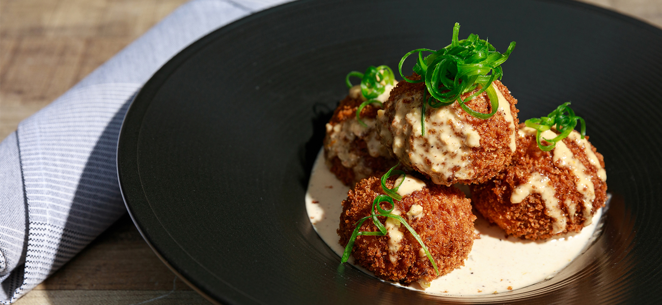 Plate of Beausoleil Coastal Cuisine’s crawfish arancini