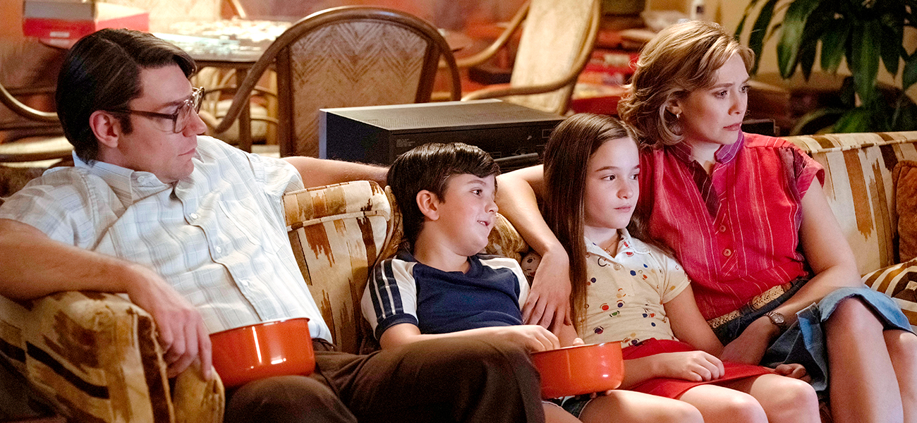 Amelie Dallimore on couch with 'Love and Death' family